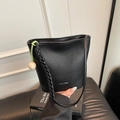 Retro black leather bucket bag with braided strap and green tassel detail - Black