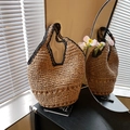 Straw woven tote bag with contrast black handles and round silhouette for summer - Khaki