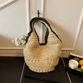 Handmade beige straw hobo bag with black trim detailing for summer beach vacations - Beige