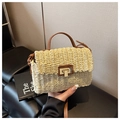 Detail of hand-woven straw bag featuring brown leather strap and gold metal twist lock - Off White