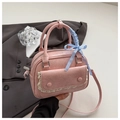 Pink pleated crossbody bag with lace flap detail and blue checkered ribbon bow accents - Pink