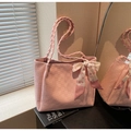 Pink tote bag with checkered embossing and cherry print silk scarf decoration on books - Pink