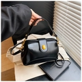 Chic black vintage doctor bag with gold hardware and amber stone detail - Black
