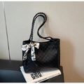 Detail of black checkered tote bag with woven handles and decorative floral silk scarf - Black