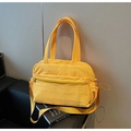 Large bright yellow quilted nylon travel bag with shoulder strap and multiple pockets - Yellow