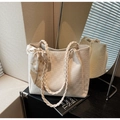 Detail of cream woven tote bag featuring handle with decorative silk scarf - Off-white