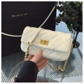 Detail of white quilted crossbody bag featuring gold twist lock and chain strap - Off-white