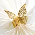 Elegante portatovagliolo a farfalla dorata con motivi traforati e glitter dorati - Oro Scintillante