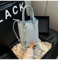 Light blue mini woven tote bag with silver heart charm and adjustable shoulder strap - Blue