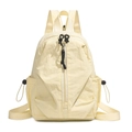 Detail view of the light yellow casual backpack featuring a stylish front vertical zipper - Beige