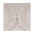 Detail showing laser-cut lace pattern and hollow design on a white wedding invitation sleeve - Ivory