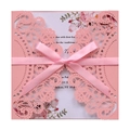 Detailed laser-cut pink lace invitation card with a silk bow and floral printed insert - Pink