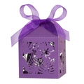 Macro view of purple laser-cut gift box with floral patterns and a silk ribbon bow - Dark Purple