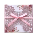 Detail of pink laser-cut floral wedding invitation with glitter finish and silk bow - Pink Glitter Laser Cut Set