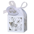 Close-up of laser-cut hibiscus and leaf patterns on white wedding candy box with bow - White (With Tag)