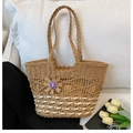 Handwoven straw tote bag in beige and natural tones with floral butterfly pendant - Brown