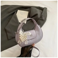 Detail of lavender wrinkled leather handbag with pearl heart charm and metal logo - Purple