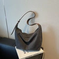 Dark grey canvas hobo tote bag with a brown adjustable leather shoulder strap and buckle - Black