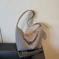 Minimalist grey suede hobo shoulder bag with contrast stitching and brown leather strap - Gray