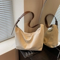 Minimalist cream white oversized tote bag with brown leather strap and matte texture - Off White