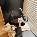 Black pleated leather half-moon shoulder bag with pearl heart charm and lace detail - Black