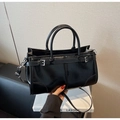 Detail of black oil wax leather tote with metal buckle and adjustable shoulder strap - Black