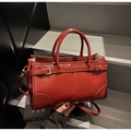 Polished red oil wax leather tote bag with decorative buckle and adjustable shoulder strap - Burgundy