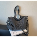 Detail view of washed denim tote bag with 3D star pattern and round coin pouch - Black