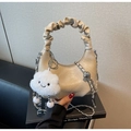 Detail of hobo bag with pleated handle, silver chain and white plush cloud charm accessory - With Charm / Khaki
