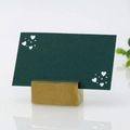Detail of elegant gold metal base and dark green card with laser-cut heart for weddings - Ink Green