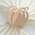 Detail of laser-cut champagne gold pumpkin paper napkin ring on white satin fabric - Beige Gold