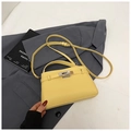 Yellow pebble grain leather Kelly bag with silver buckle and crossbody strap - Yellow