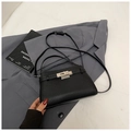 Classic black litchi texture leather handbag with silver rotary lock and shoulder strap - Black