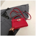 Elegant red litchi texture Kelly style handbag with gold twist lock and shoulder strap - Red