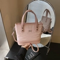 Pink canvas and PU leather bucket bag with metal logo and adjustable shoulder strap - Pink
