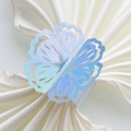 Macro shot of laser holographic hollow butterfly napkin ring on white satin fabric - 20cm / Mirror Iridescent