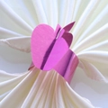 Detailed view of pink metallic apple napkin ring on a white elegant silk napkin - 17.5cm / Nail Powder
