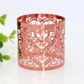 Detail shot of rose gold heart cutout napkin ring with elegant floral scroll patterns - Mirror Apple Red
