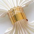 Elegant gold crown napkin ring with hollow lace texture on white silk napkin - Sparkling Gold