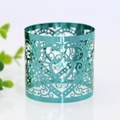 Detail of laser-cut heart pattern napkin ring with teal metallic finish for weddings - Mirror Indigo