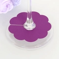 Detail showing dark purple floral paper wine glass marker on a clear stemware base - 7cm / Dark Purple
