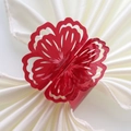 Macro detail of a laser-cut red glitter flower napkin ring on white satin fabric - 20cm / Mirror Red