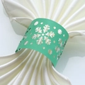 Macro detail of mint green snowflake paper napkin ring with laser-cut hollow design - 50 Pieces / Dark Green