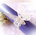 Close-up of laser-cut ivory butterfly napkin ring with intricate lace texture details - Ivory