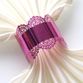 Close-up of sparkling purple napkin ring with lace patterns for wedding table decor - Nail Powder