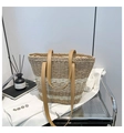 Brown and white striped straw tote bag with brown leather handles on a metal cart - Khaki
