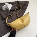 Bright yellow lychee grain leather hobo bag with adjustable strap on grey suit background - Yellow Without Pendant