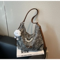 Detail of floral canvas shoulder bag with silver chain, pearls and cloud charm - Black