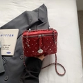 Red quilted box crossbody bag with silver studs and camellia charm detail - Burgundy