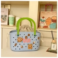 Detail of blue perforated beach tote with green handles and cute cartoon charms - Blue
